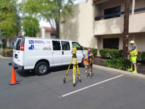 U&R surveyors with tools and van