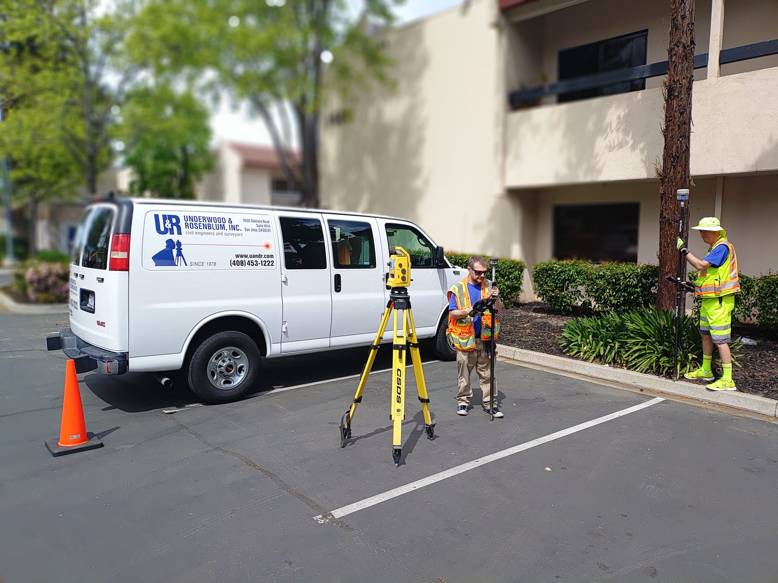 U&R surveyors with tools and van